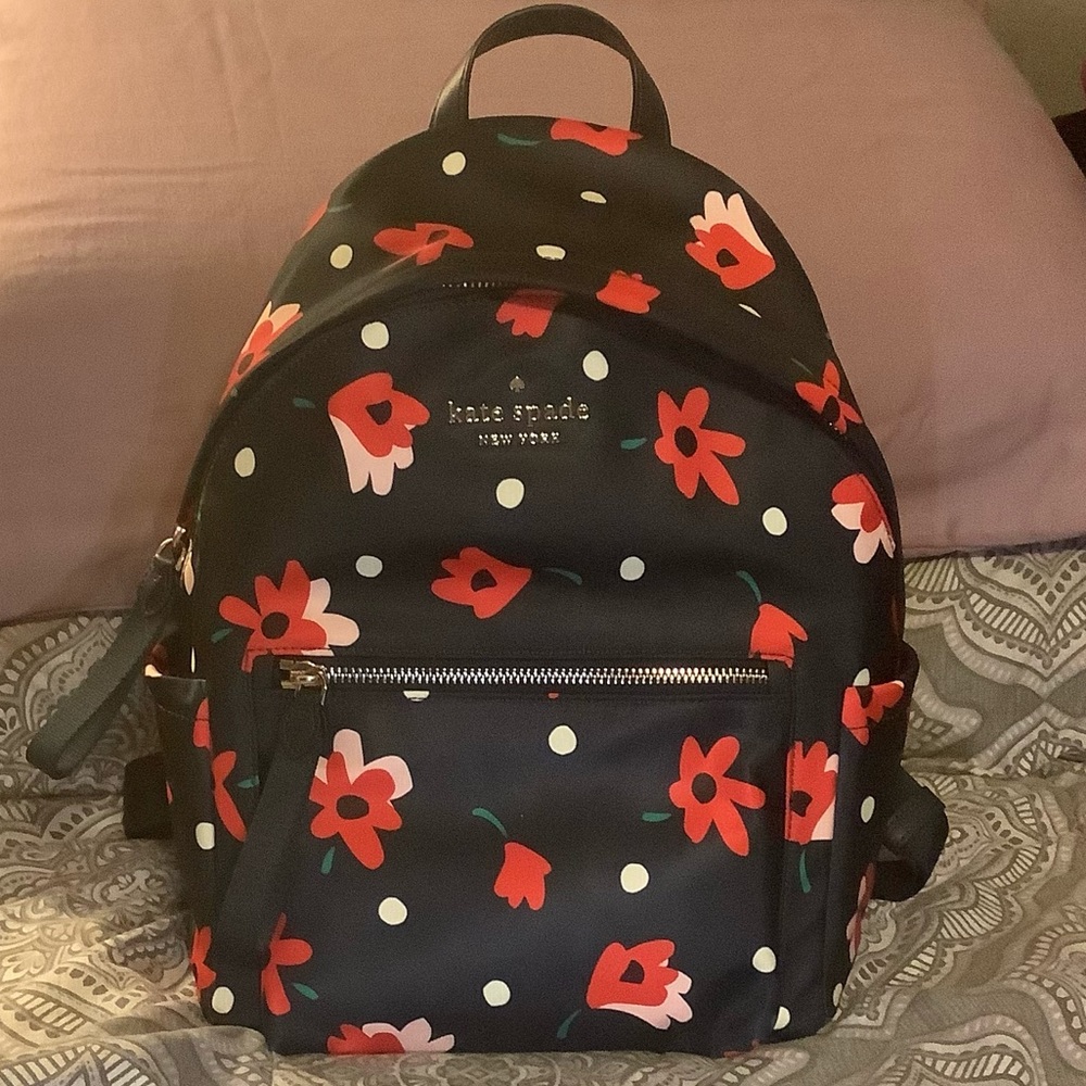Navy blue and floral Kate Spade mini backpack.